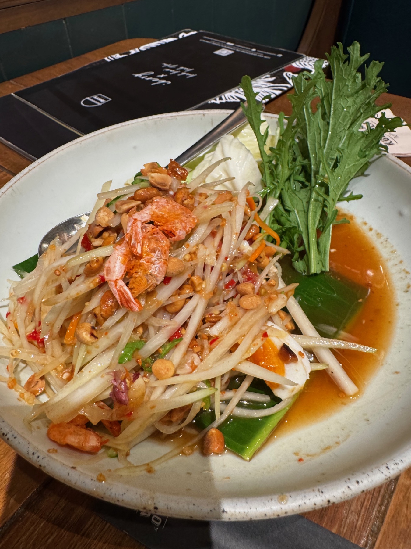 A Bangkok food bowl with noodles and greens