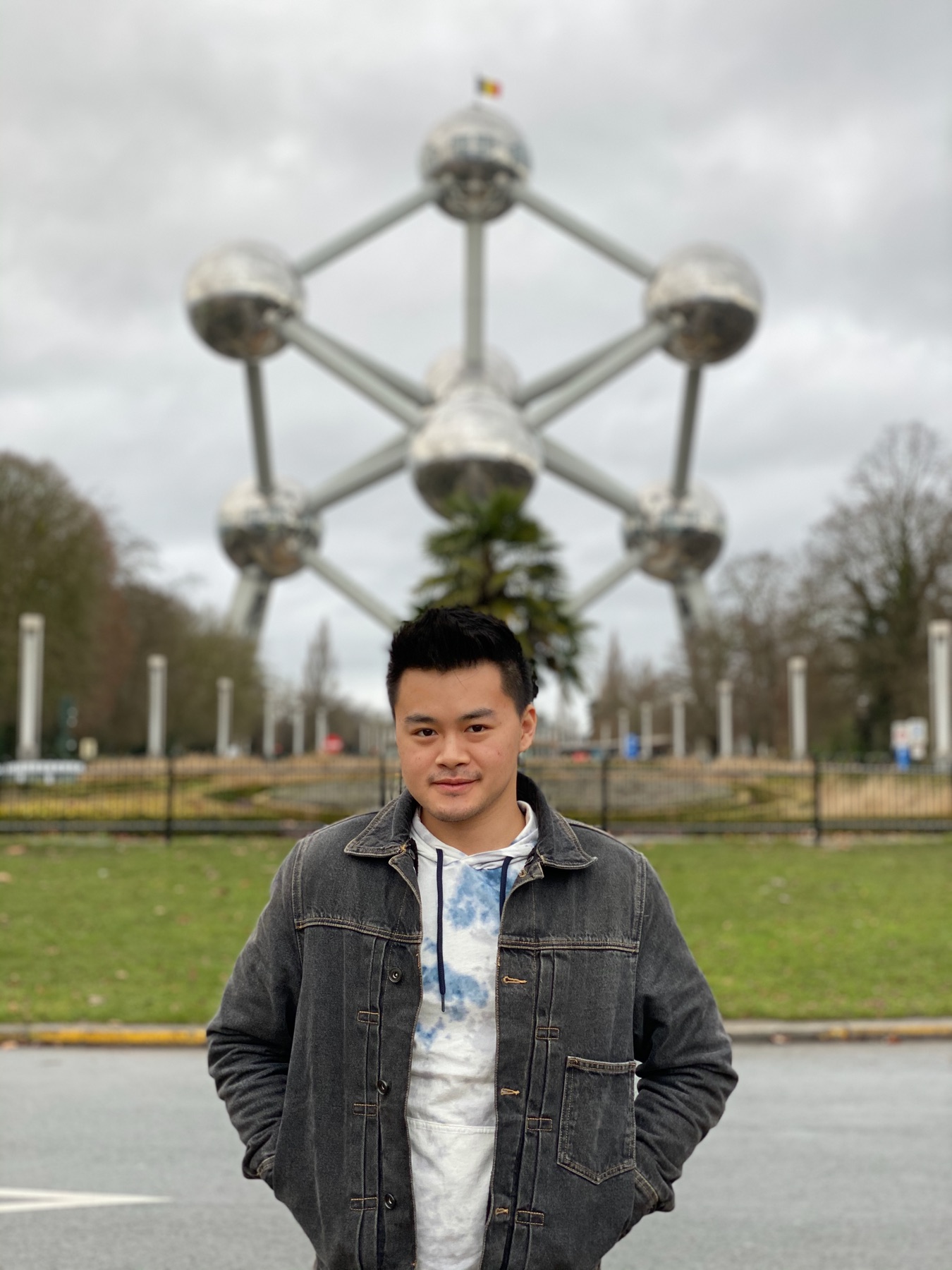 Brussels Atomium on a winter day with a traveler in the foreground