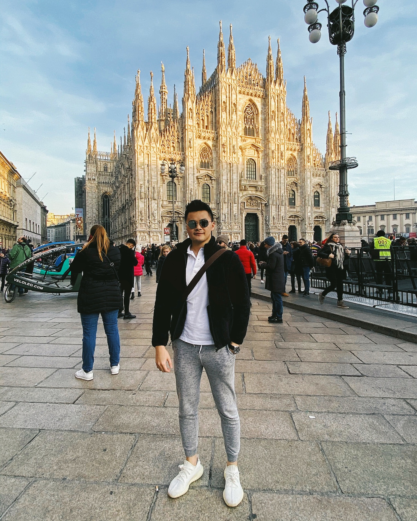 Milan Duomo square in winter with travelers and public crowds