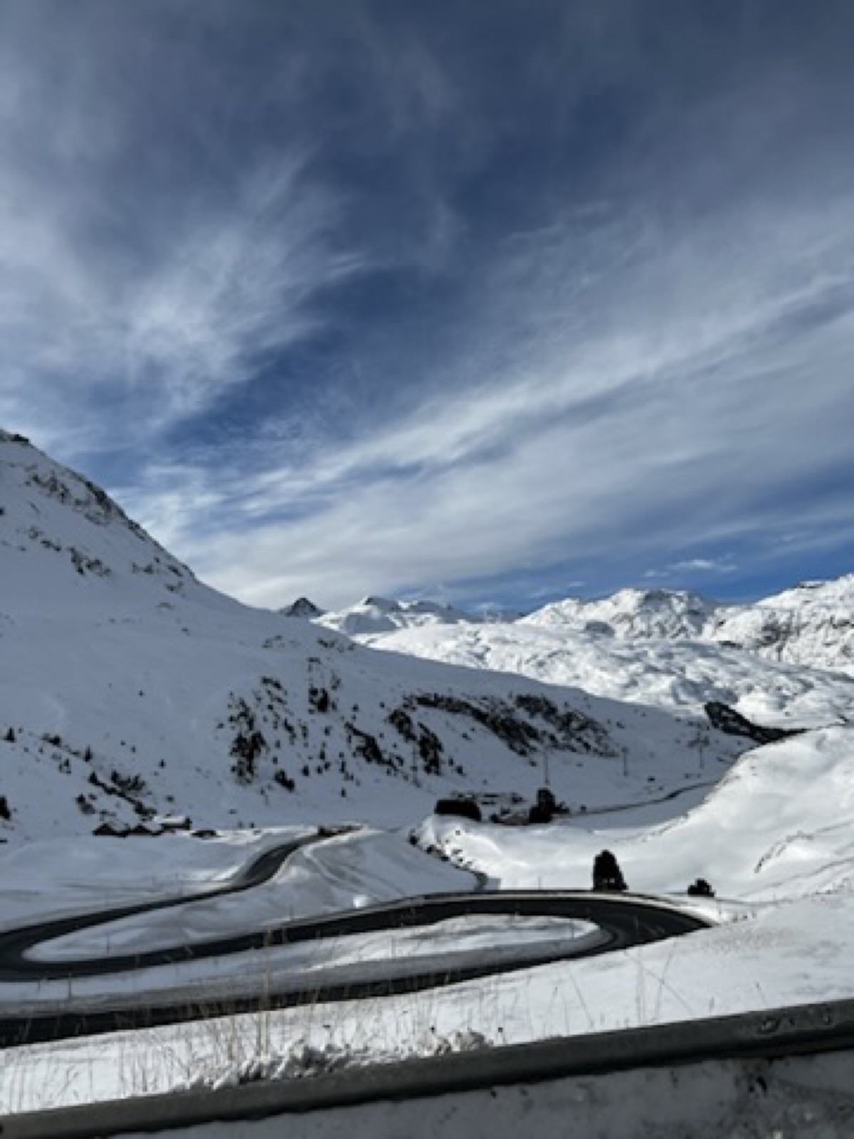 Winter road near St Moritz with snow and mountains