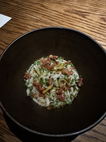 BTM Noodle course at August Jakarta served in a black bowl