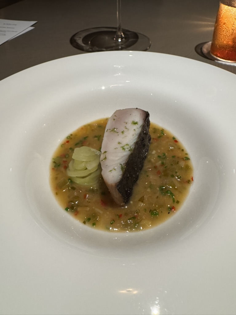 Spanish mackerel course with preserved mustard green and cane pepper