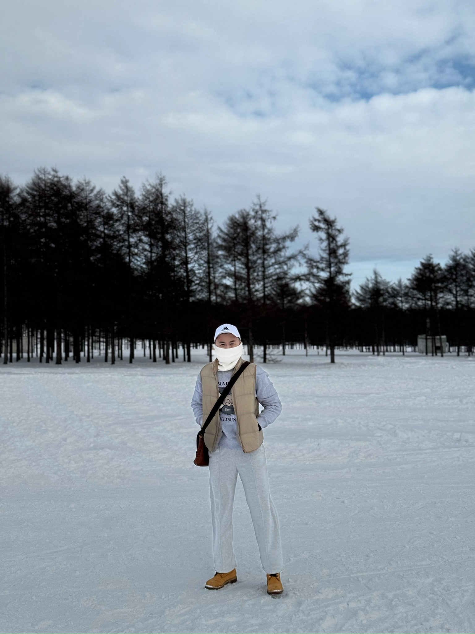 Portrait standing in the snow at Moerenuma Park