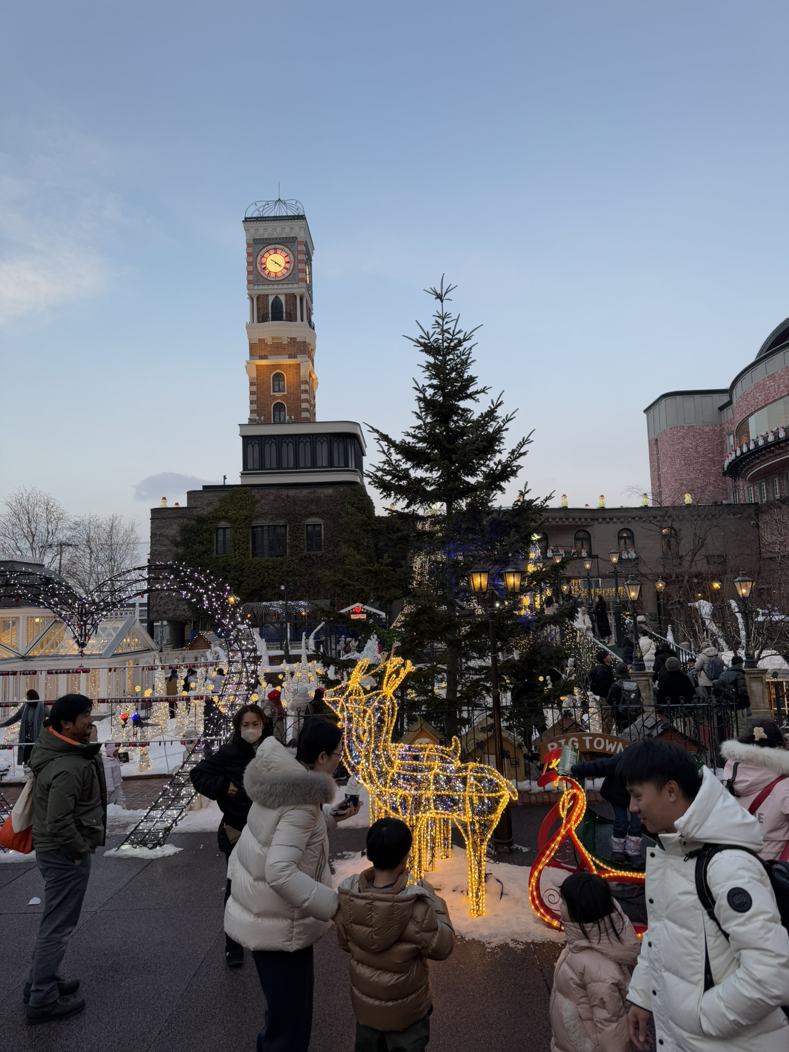 Evening lights and clock tower at Shiroi Koibito Park
