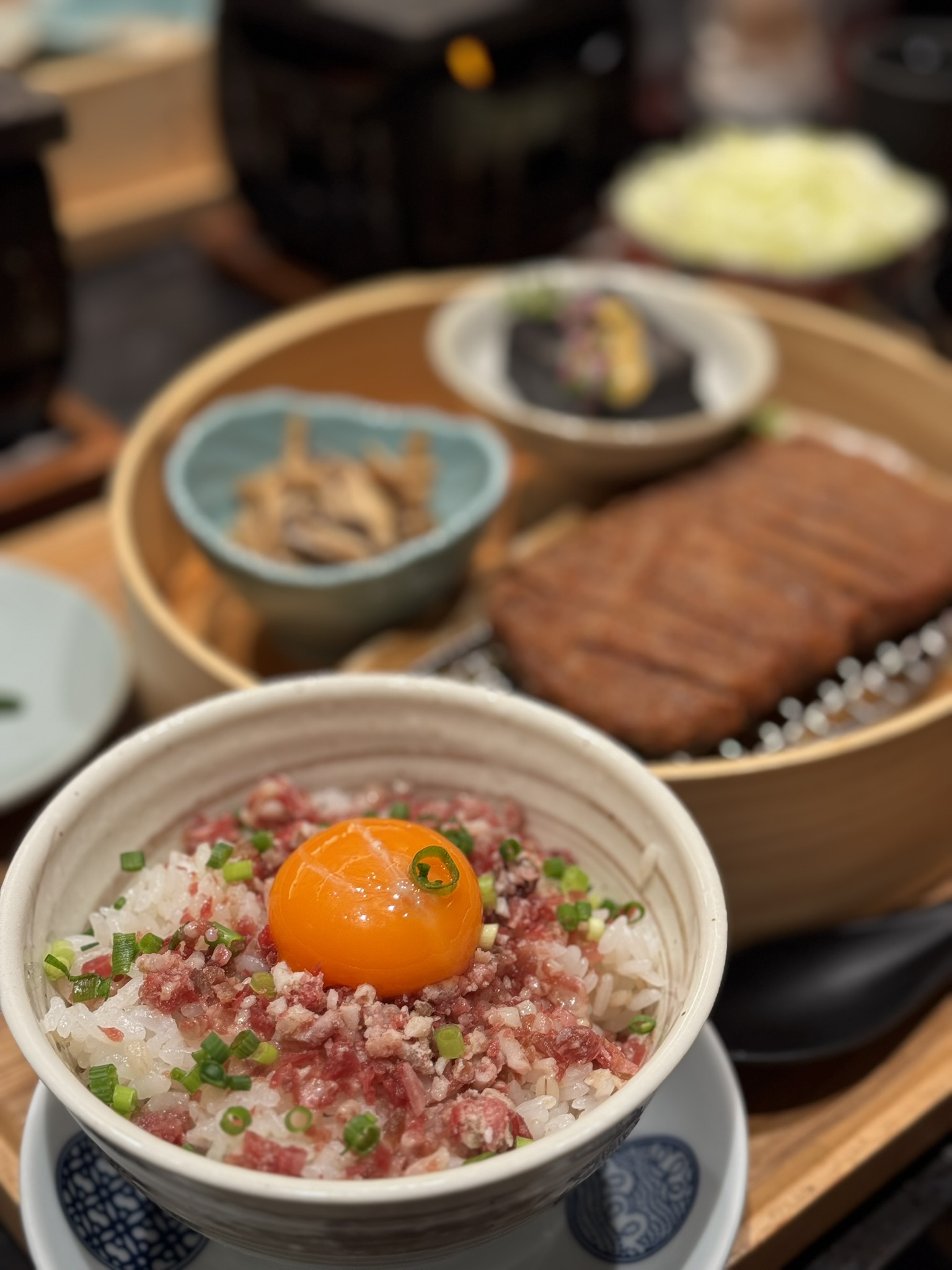 Rice bowl with minced beef and egg yolk at Gyukatsu Motomura