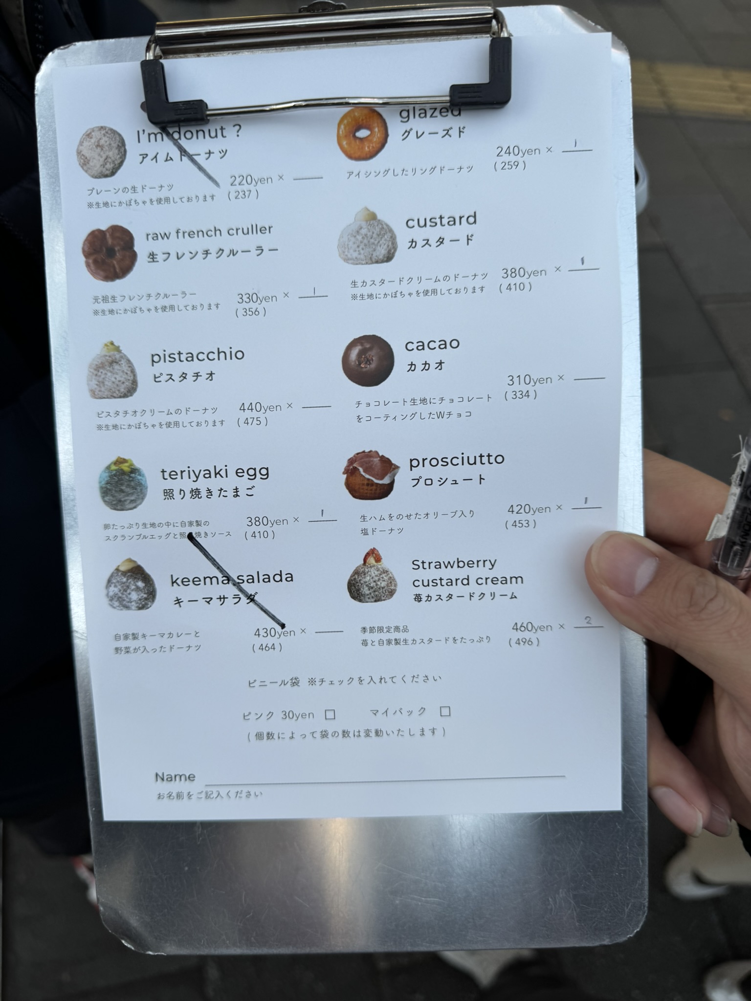 I'm donut? menu clipboard with donut flavors and prices
