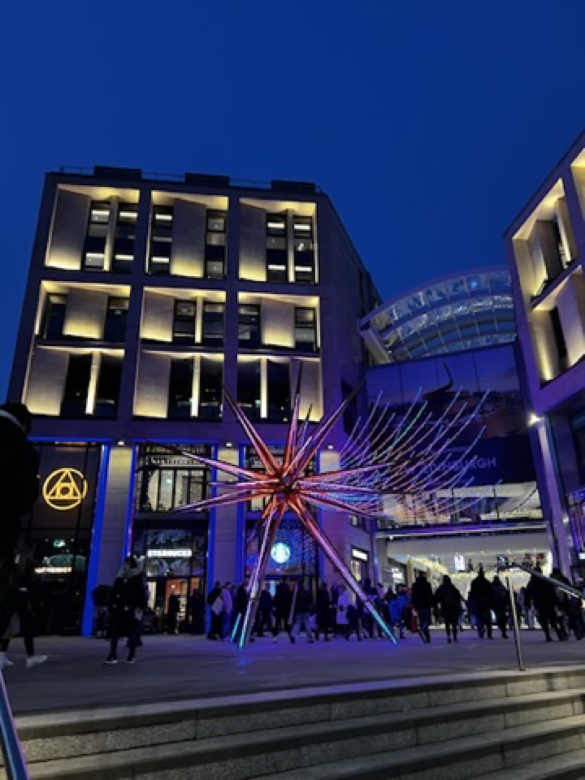 Edinburgh shopping area lit with evening lights