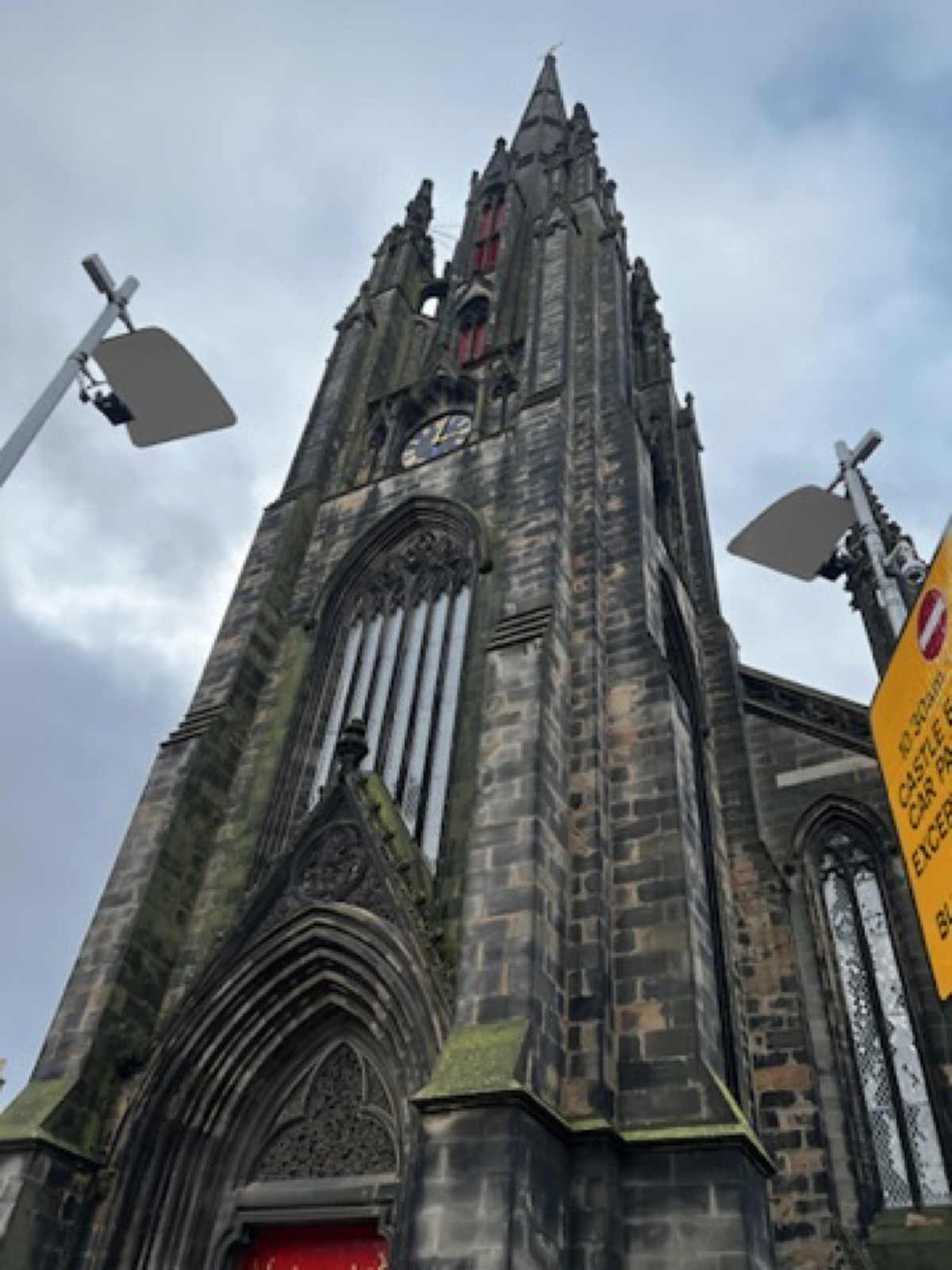 Gothic church facade rising above the street in Edinburgh
