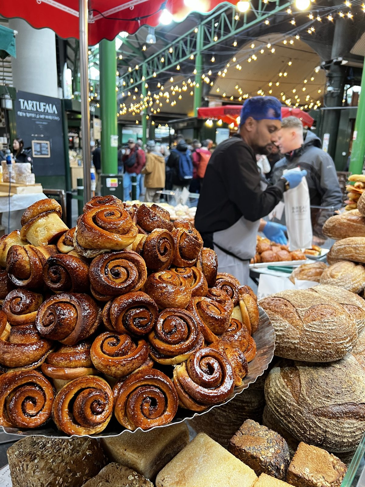 Fresh bread rolls and pastries at a London market stall
